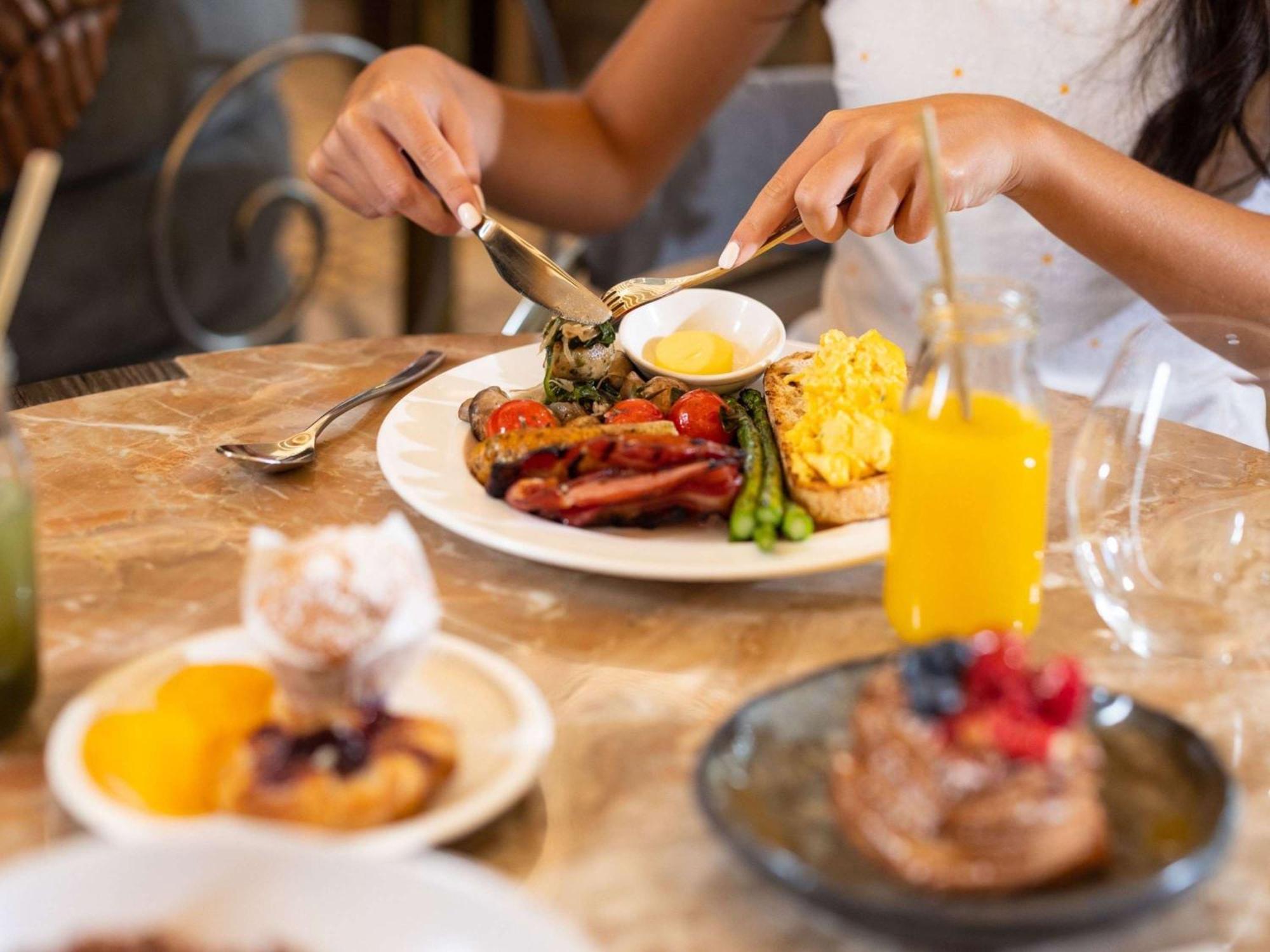 The Playford Adelaide - Mgallery Экстерьер фото A woman eating breakfast